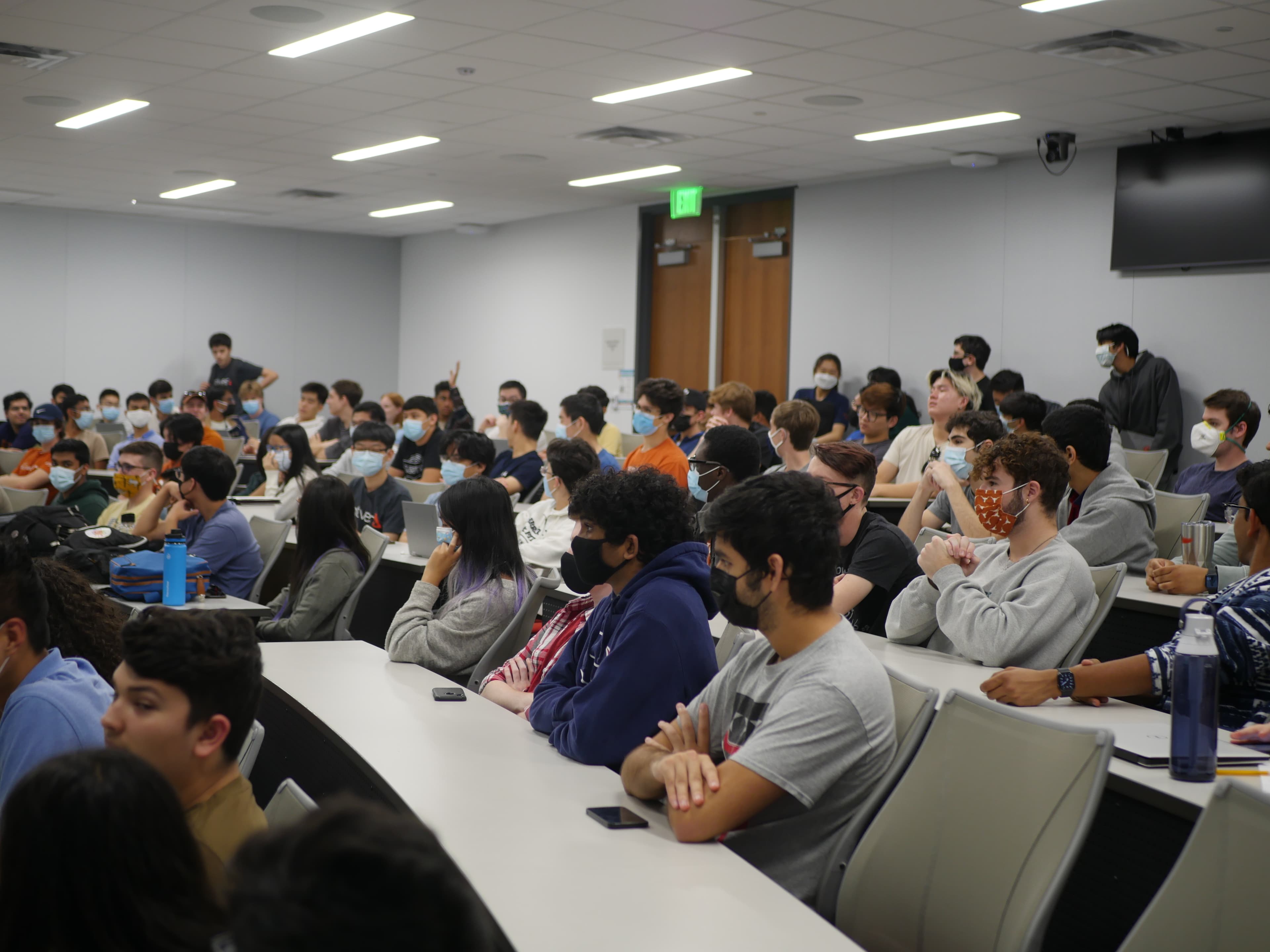 Students in general meeting in classroom listen to the presenter