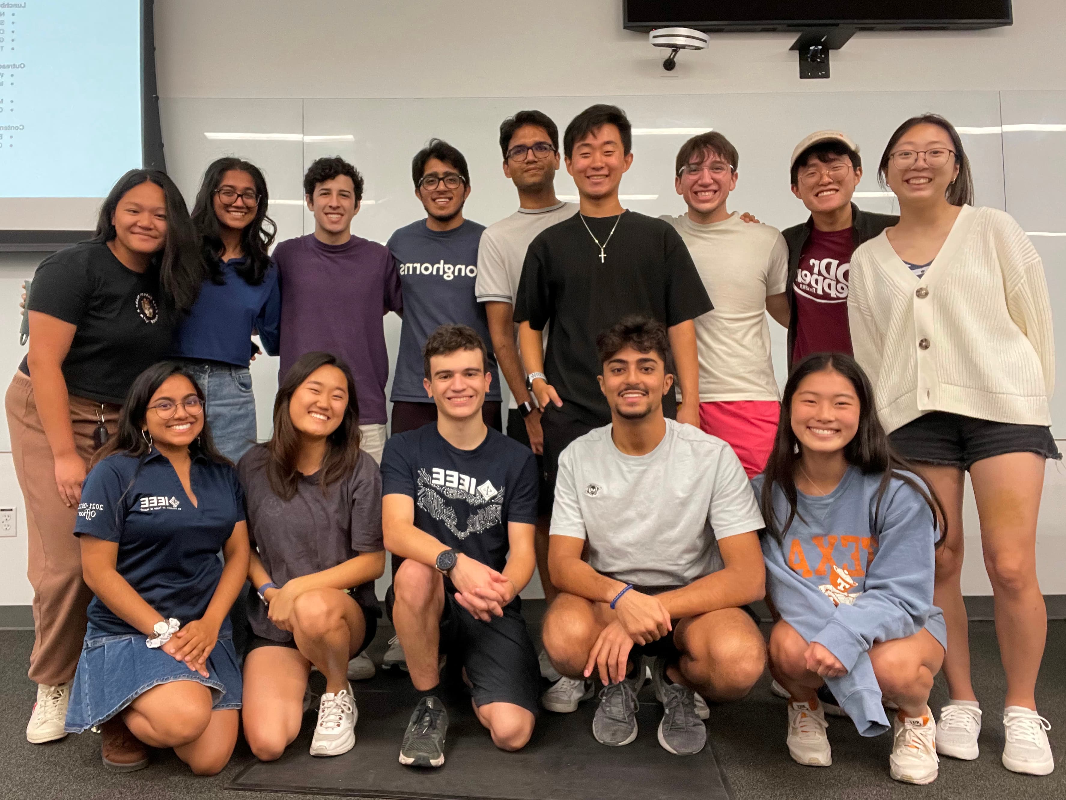 Group photo of IEEE officers of 2022-2023 in front of a classroom whiteboard