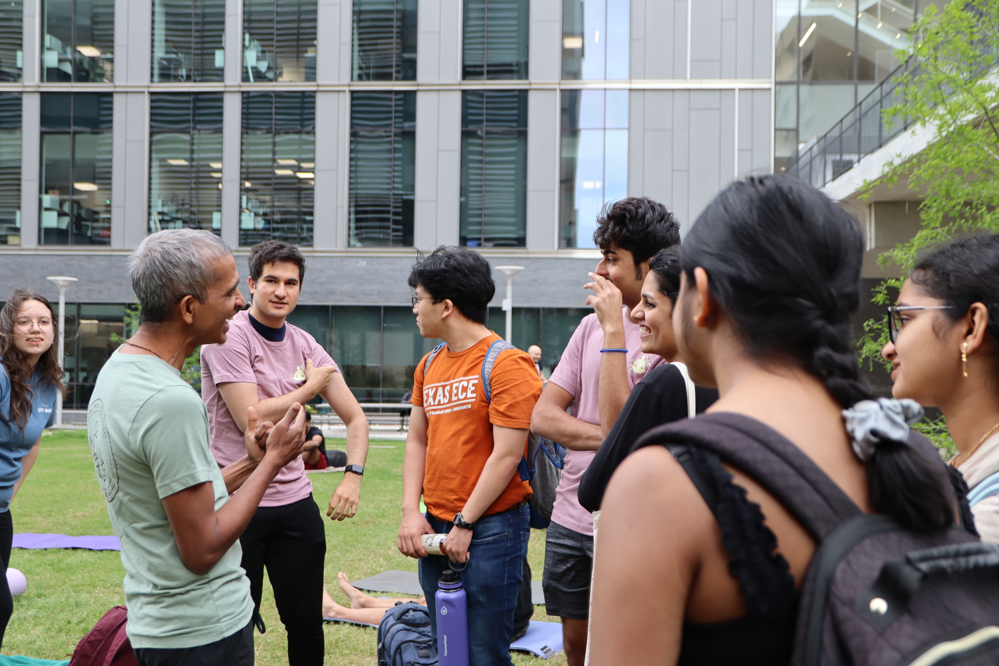 Dr. Yerraballi talks with a small group of students around him